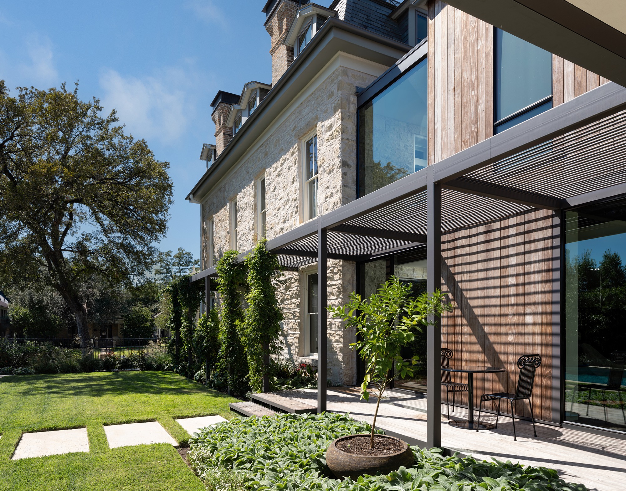 Victorian House addition with steel trellis and Kebony siding in Austin, Texas